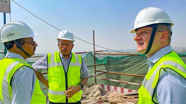 File photo of SP Goyal (centre) inspecting construction work at the Noida International Airport | ANI