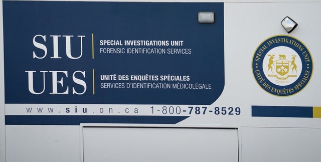 A Special Investigations Unit logo is seen on a truck at Toronto Pearson International Airport, in Mississauga, Ont., on Thursday, April 24, 2025. THE CANADIAN PRESS/Arlyn McAdorey