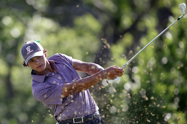 Charlie Woods hits a tee shot on the fourth hole during the first round of the U.S. Junior Amateur at Brook Hollow Golf Club on July 21, 2025 in Dallas, Texas.