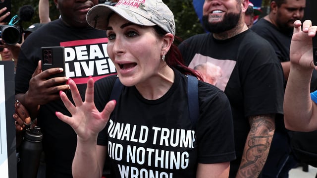 Laura Loomer argues with anti-Trump demonstrators in Atlanta, Georgia, on August 24, 2023.