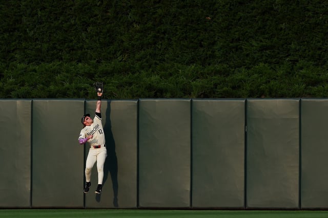 MINNEAPOLIS, MINNESOTA - JULY 29: Harrison Bader #12 of the Minnesota Twins jumps to catch a fly ball hit by Wilyer Abreu #52 of the Boston Red Sox (not pictured) for an out in the sec ond inning at Target Field on July 29, 2025 in Minneapolis, Minnesota.