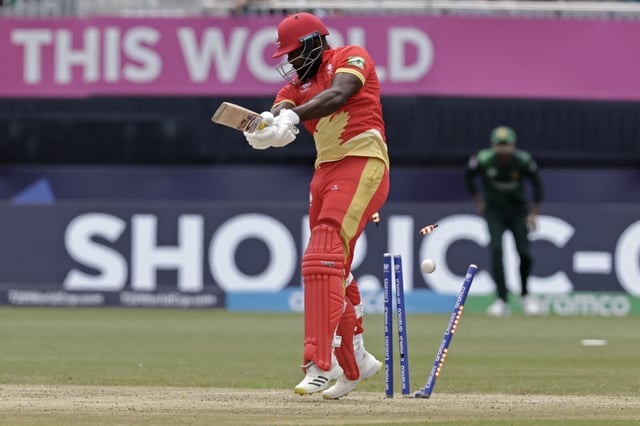 Canada's Aaron Johnson is bowled out by Pakistan's Naseem Shah during the ICC Men's T20 World Cup cricket match between Pakistan and Canada at the Nassau County International Cricket Stadium in Westbury, New York, Tuesday, June 11, 2024. (AP Photo/Adam Hunger)