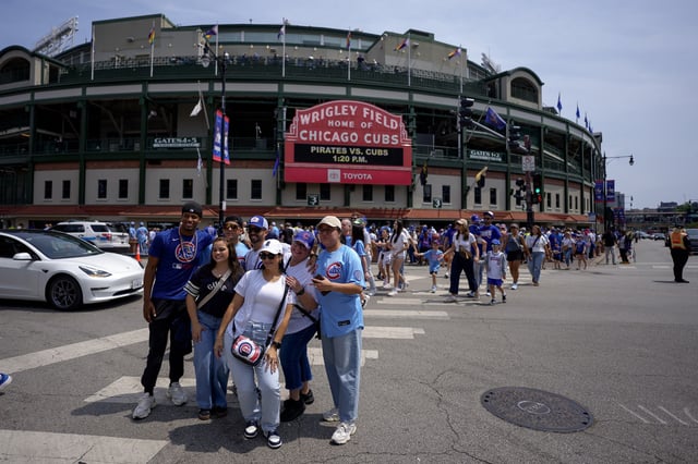 People pose outside Wrigley Field on June 15, 2025 in Chicago, Illinois. 