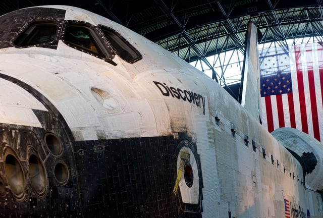 The space shuttle Discovery in the James S. McDonnell Space Hangar at the National Air and Space Museum&#39;s Steven F. Udvar-Hazy Center in Virginia. A decision over whether to move the shuttle to Houston may come on Sunday.