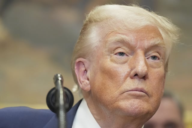 President Donald Trump listens during an event to sign an executive order restarting the Presidential Fitness Test in public schools, Thursday, July 31, 2025, in the Roosevelt Room of the White House in Washington.
