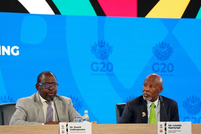 Minister of Finance of The Republic of South Africa Enoch Godongwana and Governor of the South African Reserve Bank Lesetja Kganyago participate in a press conference at the 2025 annual IMF/World Bank Spring Meetings in Washington, D.C., U.S., April 24, 2025. REUTERS/Elizabeth Frantz/File Photo