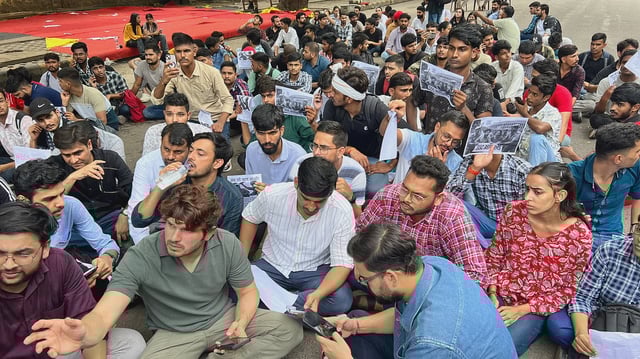 Picture showing a group of job aspirants sitting in protest.