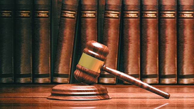 A gavel in front of law books. (Getty)