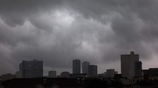 Storm clouds drop rain on downtown Fort Worth on Wednesday, April 30, 2025.