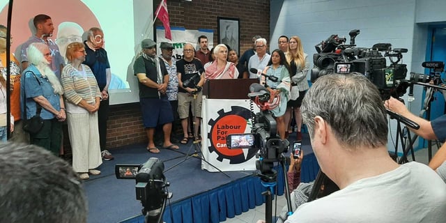Former York Region paramedic Katherine Grzejszczak speaking at the podium at a press conference on Thursday, July 31.