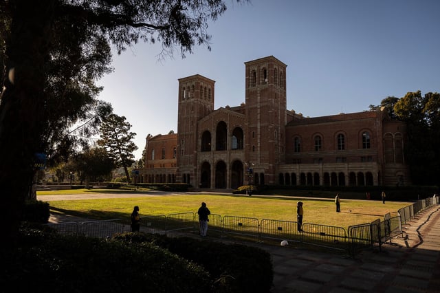 Security officers stand guard on the lawn in front of UCLA's Royce Hall on May 6, 2024, the week after a Pro-Palestinian encampment was dismantled.