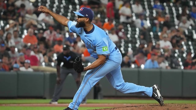 Jul 29, 2025; Baltimore, Maryland, USA; Toronto Blue Jays pitcher Seranthony Dominguez (48) pitches in the seventh inning after being acquired from the Baltimore Orioles in the middle of the doubleheader at Oriole Park at Camden Yards. Mandatory Credit: Mitch Stringer-Imagn Images
