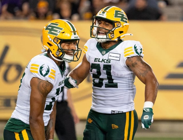 Edmonton Elks running back Justin Rankin (31) celebrates his touchdown with wide receiver Dillon Mitchell (17) during second half CFL football game action in Hamilton, Ont. on Saturday, August 17, 2024. 