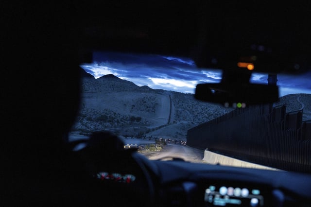 A view from inside a U.S. Border Patrol vehicle shows the U.S.-Mexico border fence at dawn in Sunland Park, N.M., Wednesday, July 23, 2025.
