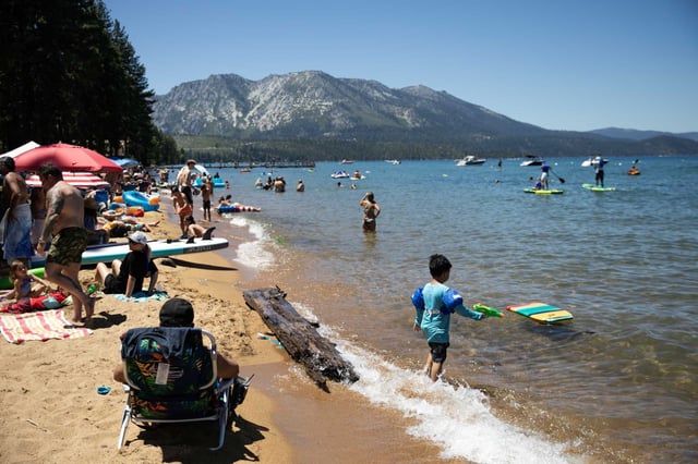 Near the beach area affected by the sewer line leak in South Lake Tahoe is the popular Baldwin Beach, where beachgoers are seen in July 2024.