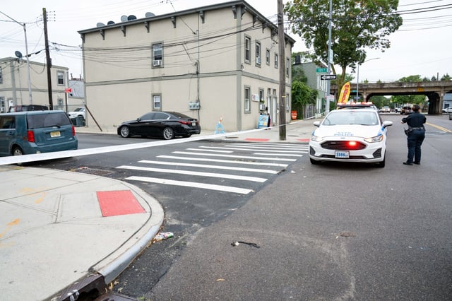 Cops responding to a report of an assault in progress at the corner of 101st St. and Liberty Ave. in Ozone Park, Queens, found a 23-year-old man sprawled out in the street with severe injuries across his body. (Theodore Parisienne / New York Daily News)