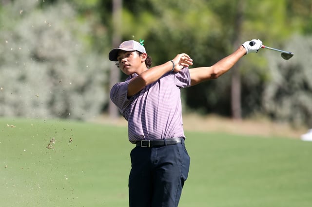 Charlie Woods of the United States hits a shot in the fairway on the18th hole during the first round of the U.S. Junior Amateur at Brook Hollow Golf Club on July 21, 2025 in Dallas, Texas.