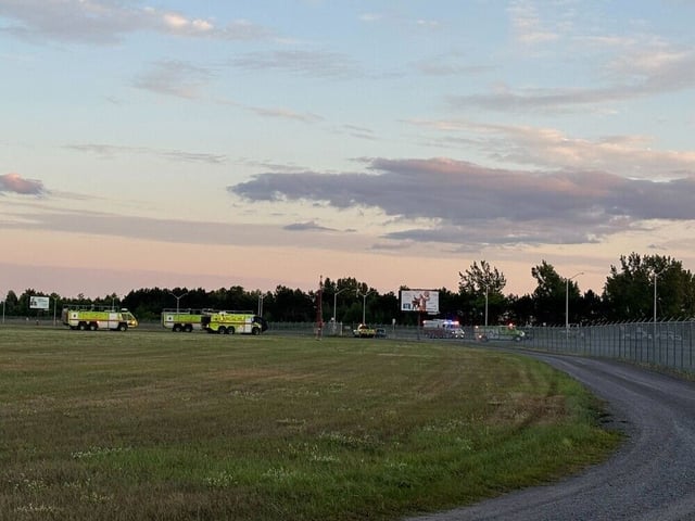 Emergency vehicles near the scene of a small plane crash near the Ottawa International Airport on Thursday evening.