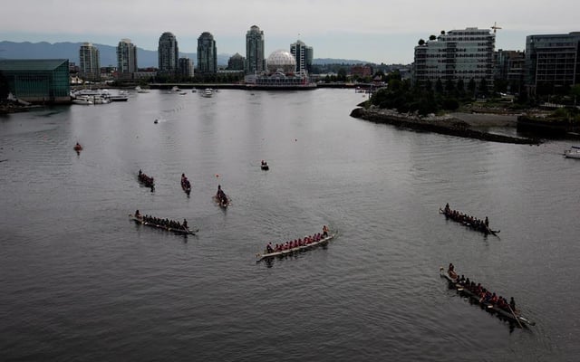 Competitors line up at the start line during the Dragon Boat Festival on False Creek in Vancouver, on Sunday June 22, 2014. 
