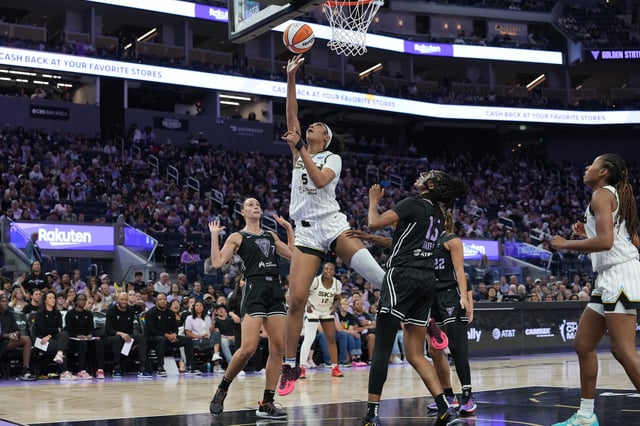Angel Reese #5 of the Chicago Sky shoots over Stephanie Talbot #7 and Tiffany Hayes #15 of the Golden State Valkyries during the first half of a WNBA basketball game at Chase Center on June 27, 2025 in San Francisco, California.
