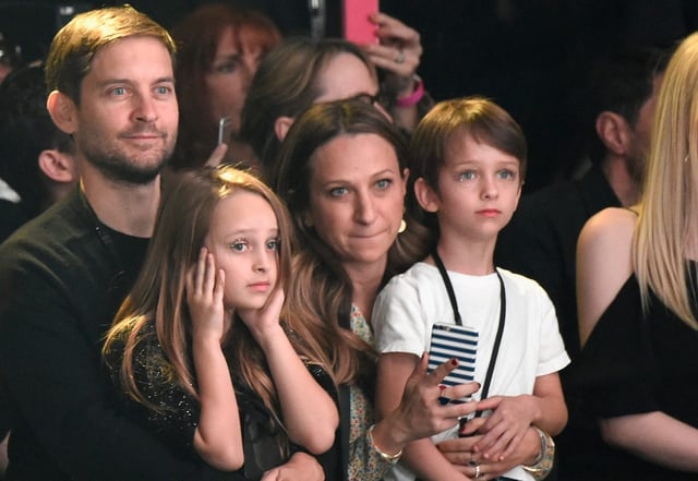 (L-R) Actor Tobey Maguire, Ruby Maguire, designer Jennifer Meyer, in Saint Laurent by Hedi Slimane, and Otis Tobias Maguire attend Saint Laurent at the Palladium on February 10, 2016 in Los Angeles, California for the Saint Laurent Los Angeles show.  (Photo by Kevin Mazur/Getty Images for SAINT LAURENT)