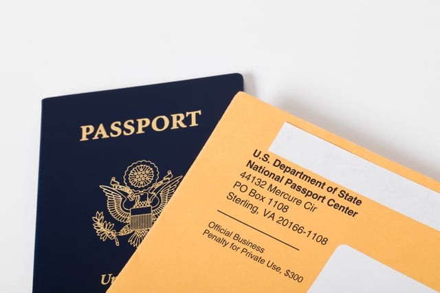An editorial stock photo of a new USA passport. Photographed isolated on a white background.