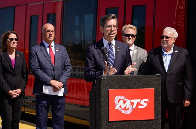 MTS officials, led by current board chair and San Diego City Councilmember Stephen Whitburn, gather at the El Cajon Transit Center to mark a new Trolley line segment, the Copper Line, in El Cajon on Friday, Sept. 27, 2024. (Alejandro Tamayo / The San Diego Union-Tribune)