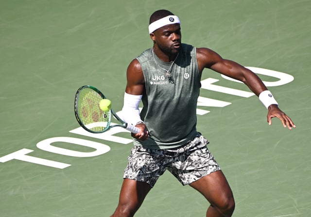 Aug 1, 2025; Toronto, ON, Canada;  Frances Tiafoe (USA) plays a shot against Aleksandar Vukic (AUS) during third round play at Sobeys Stadium. Mandatory Credit: Dan Hamilton-Imagn Images