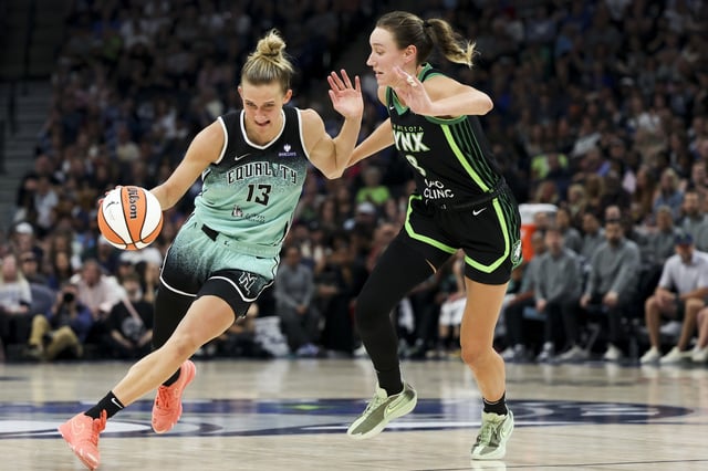 Leonie Fiebich #13 of the New York Liberty dribbles up the court while Alanna Smith #8 of the Minnesota Lynx defends in the third quarter at Target Center on July 30, 2025 in Minneapolis, Minnesota.