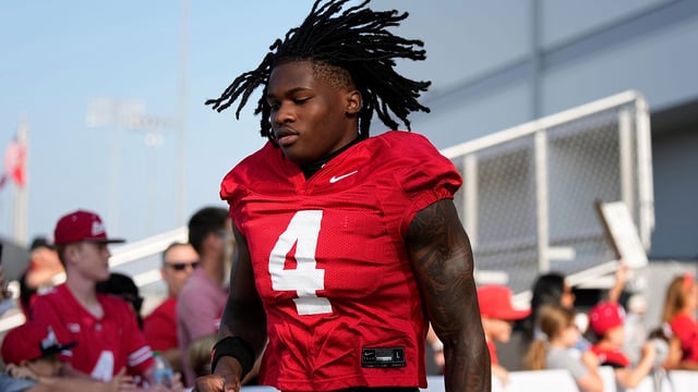 Ohio State Buckeyes wide receiver Jeremiah Smith (4) takes the field for football training camp at the Woody Hayes Athletic Center on Aug. 1, 2025. Adam Cairns/Columbus Dispatch / USA TODAY NETWORK via Imagn Images