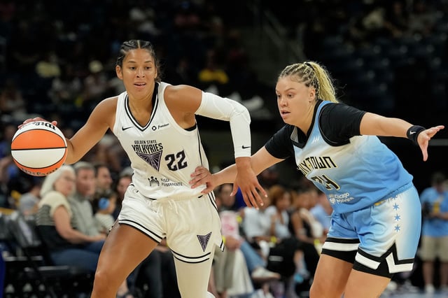 Veronica Burton #22 of the Golden State Valkyries dribbles the ball against Rachel Banham #24 of the Chicago Sky in the second quarter at Wintrust Arena on August 01, 2025 in Chicago, Illinois. 