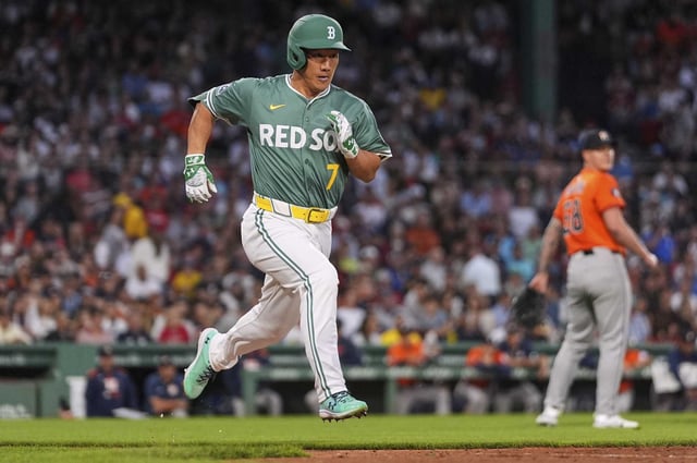 Boston Red Sox designated hitter Masataka Yoshida runs down the first base line on his groundout against the Houston Astros during the second inning of a baseball game at Fenway Park, Friday, Aug. 1, 2025, in Boston. (AP Photo/Charles Krupa)