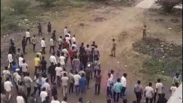 People gather after two groups clashed over a social media post, in Yavat in Pune's Daund tehsil, Friday. (PTI)