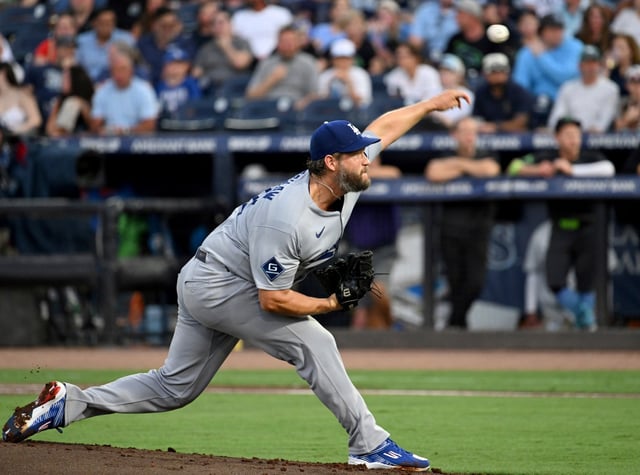 Los Angeles Dodgers pitcher Clayton Kershaw throws during the first inning of a baseball game against the Tampa Bay Rays Friday, Aug. 1, 2025, in Tampa, Fla. (AP Photo/Jason Behnken)