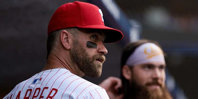 Jul 19, 2025; Philadelphia, Pennsylvania, USA; Philadelphia Phillies first base Bryce Harper (3) looks on in front of outfielder Brandon Marsh before taking the field for action against the Los Angeles Angels at Citizens Bank Park. Mandatory Credit: Bill Streicher-Imagn Images