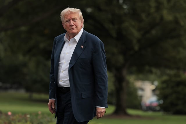 U.S. President Donald Trump walks across the South Lawn of the White House after returning on Marine One on July 29, 2025 in Washington, DC.