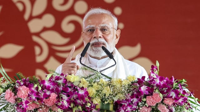 Prime Minister Narendra Modi addresses a public meeting, in Varanasi.