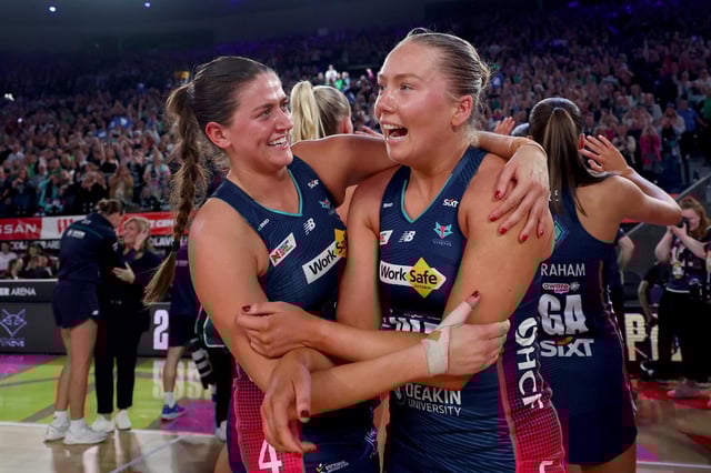 Melbourne Vixens stars Kate Eddy and Hannah Mundy celebrate the win.