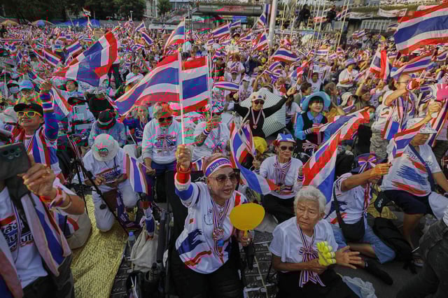 Protesters waving Thailand flags gather at Victory Monument demanding Prime Minister Paetongtarn Shinawatra resign in Bangkok, Thailand, Saturday, Aug. 2, 2025. (AP Photo/Tadchakorn Kitchaiphon)