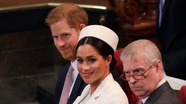 Awkward much? Meghan, Duchess of Sussex sits with Prince Harry and Prince Andrew at a  2019 church service.