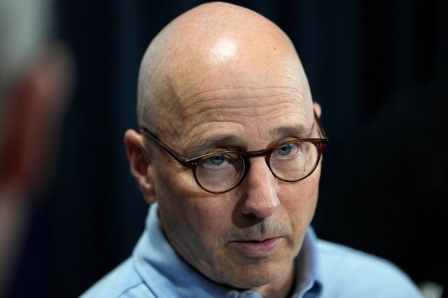 New York Yankees general manager Brian Cashman speaks to reporters during a baseball spring training media day Thursday, Feb. 15, 2024, in Tampa, Fla. (AP Photo/Charlie Neibergall)