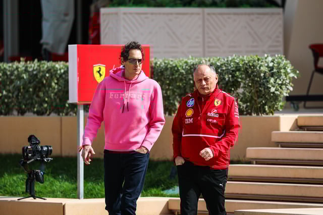 Chairman of Ferrari John Elkann and Ferrari Team Principal Frederic Vasseur walk in the paddock during day three of F1 Testing at Bahrain International Circuit on February 28, 2025 in Bahrain, Bahrain.