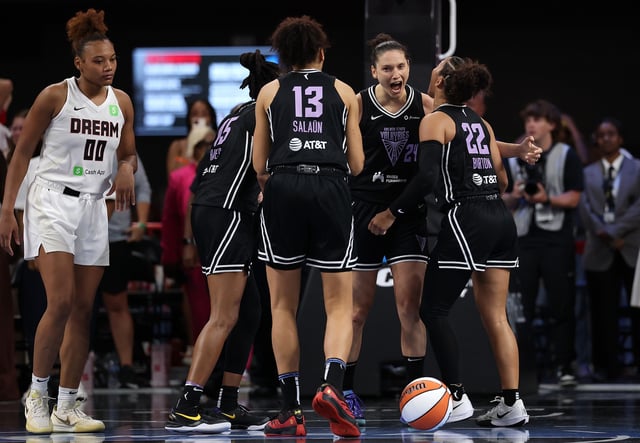 Cecilia Zandalasini #24 of the Golden State Valkyries celebrates with Veronica Burton #22, Janelle Salaun #13 and Tiffany Hayes #15 after their 77-75 win over the Atlanta Dream at Gateway Center Arena on July 29, 2025 in College Park, Georgia.