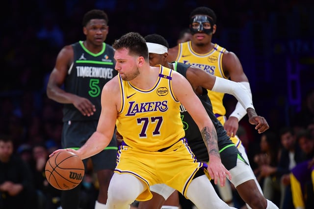 Apr 30, 2025; Los Angeles, California, USA; Los Angeles Lakers guard Luka Doncic (77) controls the ball against the Minnesota Timberwolves during the second half in game five of first round for the 2025 NBA Playoffs at Crypto.com Arena. Mandatory Credit: Gary A. Vasquez-Imagn Images/File Photo