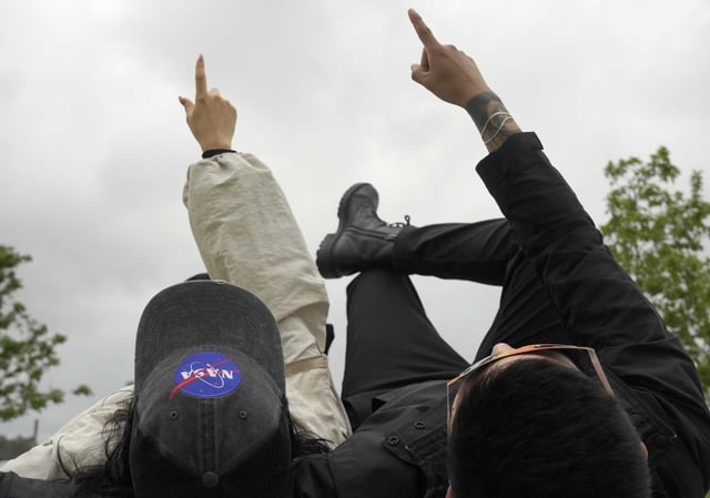Observers watch the near total solar eclipse in Houston in 2024.