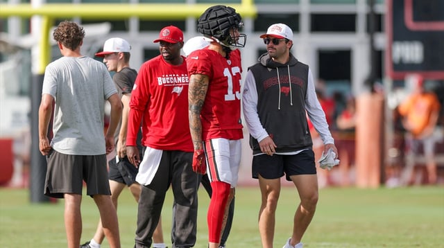 Aug 1, 2025; Tampa, FL, USA; Tampa Bay Buccaneers quarterback Baker Mayfield (6) talks to wide receiver Mike Evans (13) during training camp at AdventHealth Training Center.