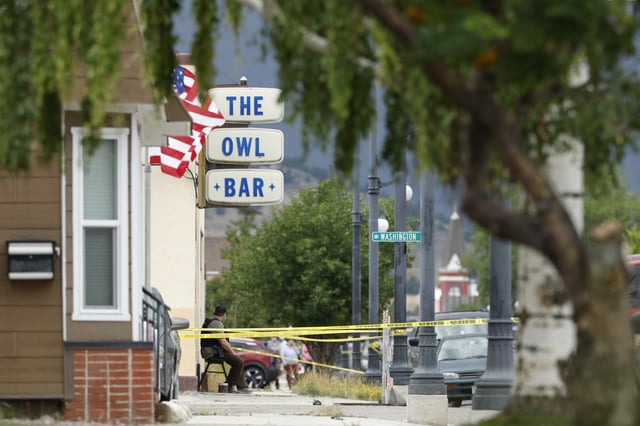 Police tape surrounds The Owl Bar in of Anaconda, Mont., on Friday, Aug. 1, 2025, following a fatal shooting.