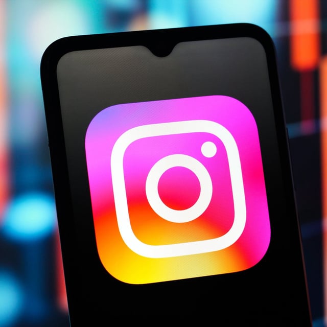 Instagram logo is seen displayed on a smartphone screen.