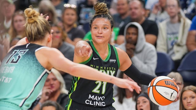 Jul 30, 2025; Minneapolis, Minnesota, USA; Minnesota Lynx guard Kayla McBride (21) dribbles against the New York Liberty forward Leonie Fiebich (13) in the second quarter at Target Center. Mandatory Credit: Brad Rempel-Imagn Images