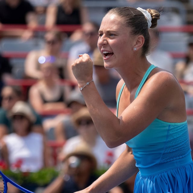 Marta Kostyuk of Ukraine reacts during her game against McCartney Kessler of the United States during round of 16 tennis action at the National Bank Open in Montreal, Saturday, Aug. 2, 2025. THE CANADIAN PRESS/Christinne Muschi